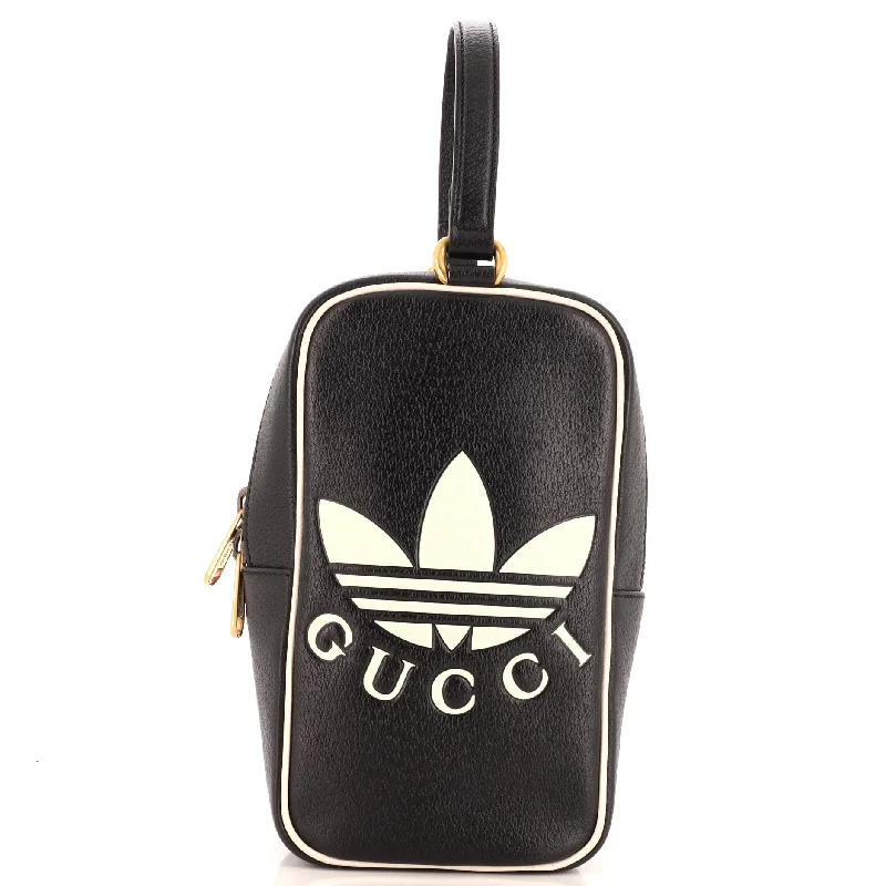 Shoulder bags with playful pom-poms for charm -x adidas Top Handle Bag Leather Mini