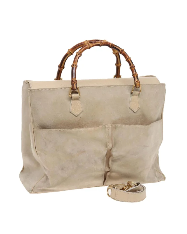 Tote bags with perforated leather for a breathable and stylish finish-Bamboo Handle Suede Tote Bag with Shoulder Strap