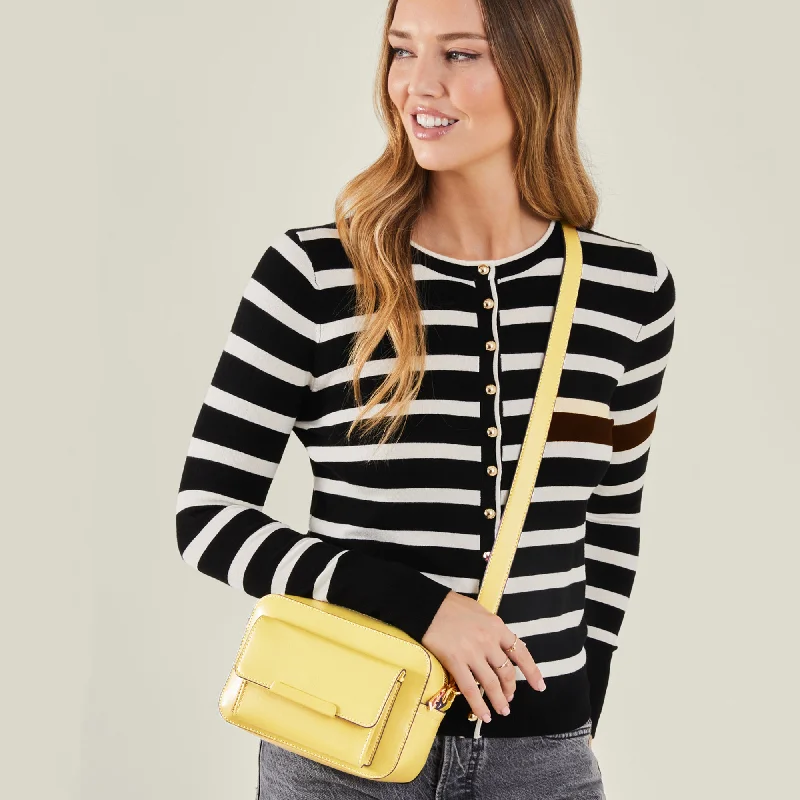 Reversible handle bags offering dual design styles -Accessorize London Women's Yellow Pocket Sling Bag