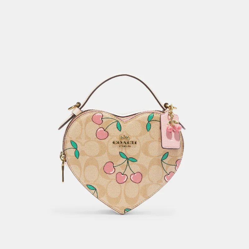 Handle bags with woven fabric for texture -Coach Outlet Heart Crossbody In Signature Canvas With Heart Cherry Print