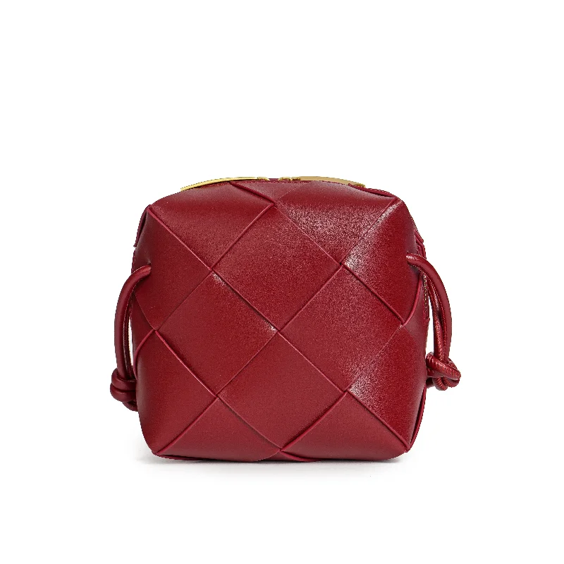 Handle bags with modern cutouts for style -Tiffany & Fred Smooth Woven Leather Crossbody Bag